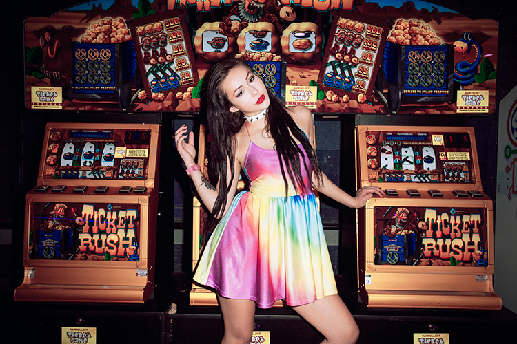 @_hannahdaisy wears Jennifer Hope Clothing in an arcade